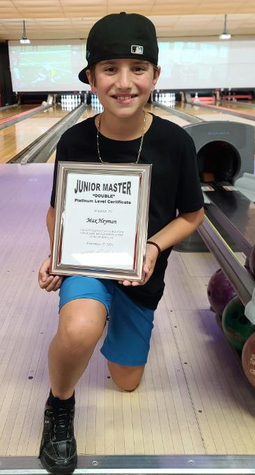 Max Heyman with his Junior Master DOUBLE Platinum certificate